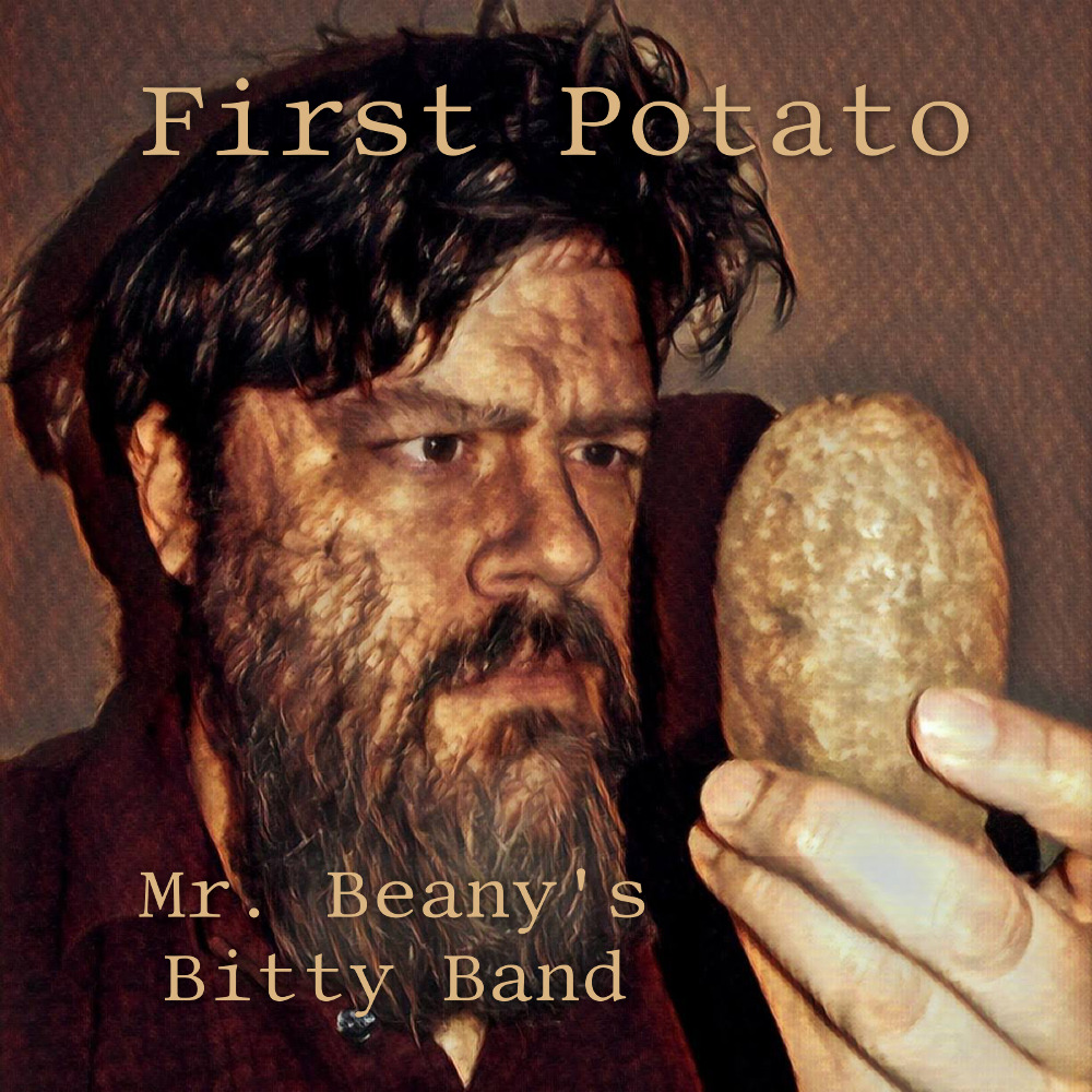 A man stares intently at a potato.